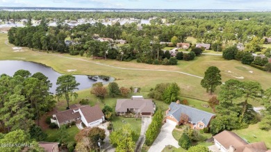 Welcome to this stunning 3-bedroom, 2.5-bathroom brick ranch on Harbour Point Golf Club in North Carolina - for sale on GolfHomes.com, golf home, golf lot