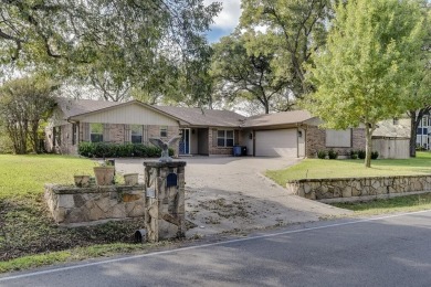 This 3-bedroom, 2-bathroom home is nestled in the highly coveted on Pecan Plantation Country Club in Texas - for sale on GolfHomes.com, golf home, golf lot