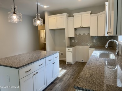 Welcome to your dream home! This stunning 2,352 square foot on Woodlake Country Club in North Carolina - for sale on GolfHomes.com, golf home, golf lot