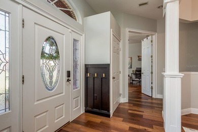 Welcome to this beautifully remodeled brick estate nestled on a on East Lake Woodlands Country Club in Florida - for sale on GolfHomes.com, golf home, golf lot