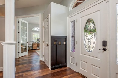 Welcome to this beautifully remodeled brick estate nestled on a on East Lake Woodlands Country Club in Florida - for sale on GolfHomes.com, golf home, golf lot