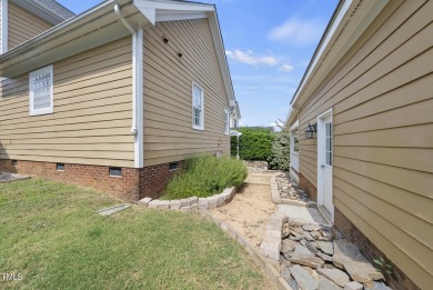 Explore this charming Charleston-style home in Sunset Ridge on Devils Ridge Golf Club in North Carolina - for sale on GolfHomes.com, golf home, golf lot