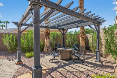 Charming home w/stone facade + extended paver front courtyard on Arizona Traditions Golf Club in Arizona - for sale on GolfHomes.com, golf home, golf lot