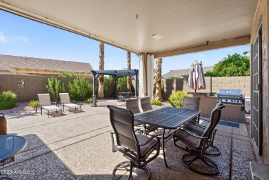 Charming home w/stone facade + extended paver front courtyard on Arizona Traditions Golf Club in Arizona - for sale on GolfHomes.com, golf home, golf lot