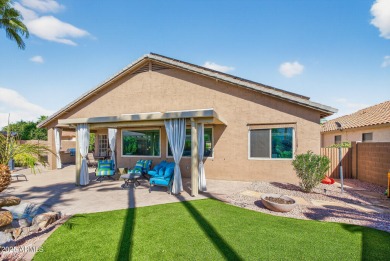 Charming home w/stone facade + extended paver front courtyard on Arizona Traditions Golf Club in Arizona - for sale on GolfHomes.com, golf home, golf lot