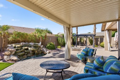 Charming home w/stone facade + extended paver front courtyard on Arizona Traditions Golf Club in Arizona - for sale on GolfHomes.com, golf home, golf lot
