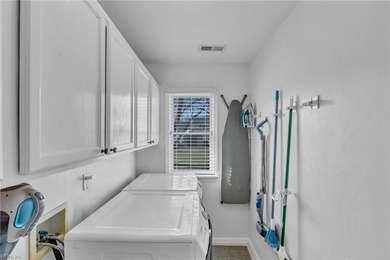 Beautifully updated 2-story residence tucked away at the end of on Sleepy Hole in Virginia - for sale on GolfHomes.com, golf home, golf lot