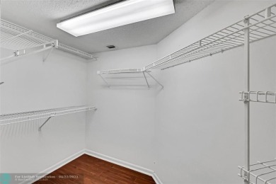 This 'JUNIPER' FLOOR PLAN HAS INSIDE WASHER/DRYER, UPDATED on Wynmoor Golf Course in Florida - for sale on GolfHomes.com, golf home, golf lot