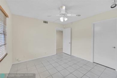 This 'JUNIPER' FLOOR PLAN HAS INSIDE WASHER/DRYER, UPDATED on Wynmoor Golf Course in Florida - for sale on GolfHomes.com, golf home, golf lot