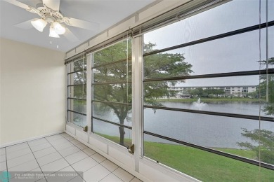This 'JUNIPER' FLOOR PLAN HAS INSIDE WASHER/DRYER, UPDATED on Wynmoor Golf Course in Florida - for sale on GolfHomes.com, golf home, golf lot