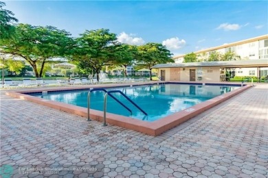 This 'JUNIPER' FLOOR PLAN HAS INSIDE WASHER/DRYER, UPDATED on Wynmoor Golf Course in Florida - for sale on GolfHomes.com, golf home, golf lot