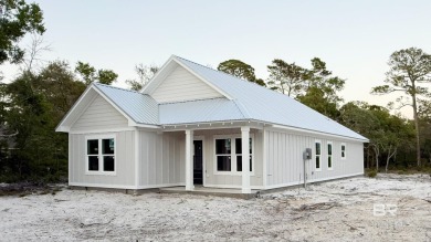 Brand-new construction situated on a peaceful half-acre wooded on Peninsula Golf and Racquet Club in Alabama - for sale on GolfHomes.com, golf home, golf lot