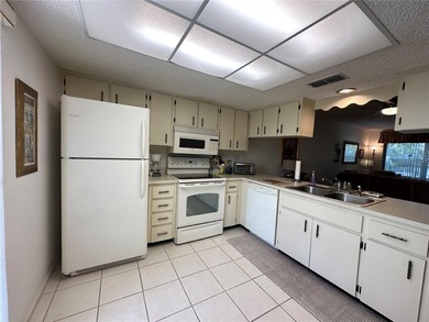 Enjoy easy Florida living in the desirable 55+ golf community of on Beacon Woods Golf Club in Florida - for sale on GolfHomes.com, golf home, golf lot