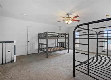 This stunning two story is perfectly situated between Shadow on White Bluff Resort - New Course in Texas - for sale on GolfHomes.com, golf home, golf lot
