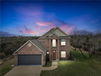 This stunning two story is perfectly situated between Shadow on White Bluff Resort - New Course in Texas - for sale on GolfHomes.com, golf home, golf lot