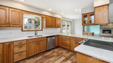 This home has had extreme care and is completely move in ready! on Escanaba Country Club in Michigan - for sale on GolfHomes.com, golf home, golf lot