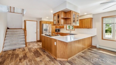 This home has had extreme care and is completely move in ready! on Escanaba Country Club in Michigan - for sale on GolfHomes.com, golf home, golf lot