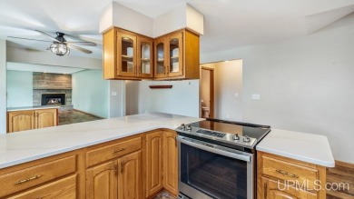 This home has had extreme care and is completely move in ready! on Escanaba Country Club in Michigan - for sale on GolfHomes.com, golf home, golf lot