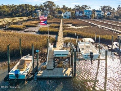 Prepare to be captivated by this extraordinary waterfront on Oak Island Golf Club in North Carolina - for sale on GolfHomes.com, golf home, golf lot