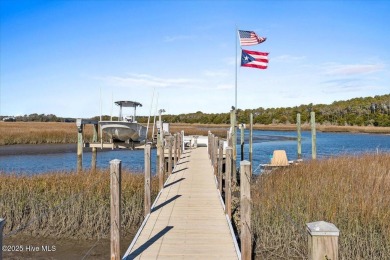 Prepare to be captivated by this extraordinary waterfront on Oak Island Golf Club in North Carolina - for sale on GolfHomes.com, golf home, golf lot