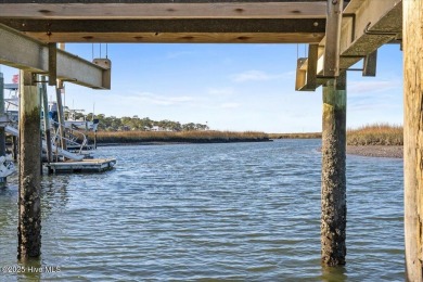 Prepare to be captivated by this extraordinary waterfront on Oak Island Golf Club in North Carolina - for sale on GolfHomes.com, golf home, golf lot