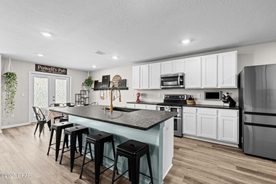 This exquisite 5-bedroom, 4-bathroom home boasts 4,128 sq/ft of on Bay Dunes in Florida - for sale on GolfHomes.com, golf home, golf lot