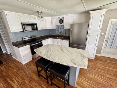 Charming Remodeled Home with Modern Upgrades! Welcome to this on High Point Golf Club, Inc. in Florida - for sale on GolfHomes.com, golf home, golf lot