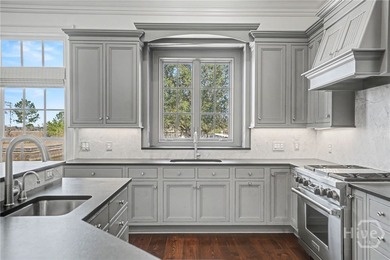 Positioned along the storied banks of Silk Hope Harbour Marina on The Ford Field and River Club  in Georgia - for sale on GolfHomes.com, golf home, golf lot