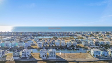 Situated in a private gated community overlooking one of Sunset on Oyster Bay Golf Links in North Carolina - for sale on GolfHomes.com, golf home, golf lot