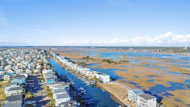 Situated in a private gated community overlooking one of Sunset on Oyster Bay Golf Links in North Carolina - for sale on GolfHomes.com, golf home, golf lot