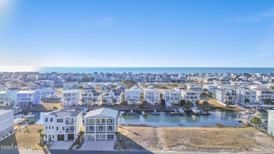 Situated in a private gated community overlooking one of Sunset on Oyster Bay Golf Links in North Carolina - for sale on GolfHomes.com, golf home, golf lot
