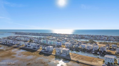 Situated in a private gated community overlooking one of Sunset on Oyster Bay Golf Links in North Carolina - for sale on GolfHomes.com, golf home, golf lot