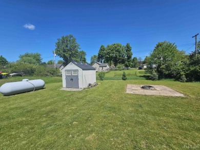 This three bedroom, two full bath home is located on a large lot on Crystal View Municipal Golf Course in Michigan - for sale on GolfHomes.com, golf home, golf lot