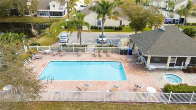 Wake up each morning to peaceful golf course views in this on East Bay Golf Club in Florida - for sale on GolfHomes.com, golf home, golf lot