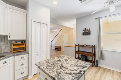 Wake up each morning to peaceful golf course views in this on East Bay Golf Club in Florida - for sale on GolfHomes.com, golf home, golf lot