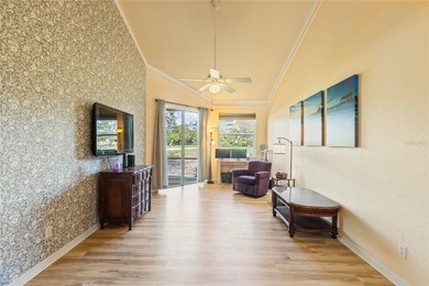 Wake up each morning to peaceful golf course views in this on East Bay Golf Club in Florida - for sale on GolfHomes.com, golf home, golf lot