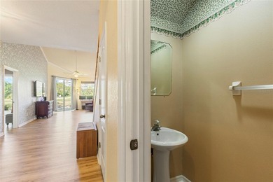 Wake up each morning to peaceful golf course views in this on East Bay Golf Club in Florida - for sale on GolfHomes.com, golf home, golf lot