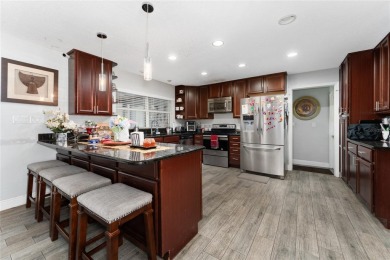 This beautifully maintained home features 4-bedrooms, 2.5-baths on Rio Pinar Golf and Country Club in Florida - for sale on GolfHomes.com, golf home, golf lot