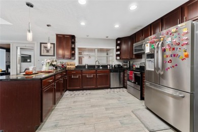 This beautifully maintained home features 4-bedrooms, 2.5-baths on Rio Pinar Golf and Country Club in Florida - for sale on GolfHomes.com, golf home, golf lot