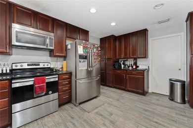 This beautifully maintained home features 4-bedrooms, 2.5-baths on Rio Pinar Golf and Country Club in Florida - for sale on GolfHomes.com, golf home, golf lot