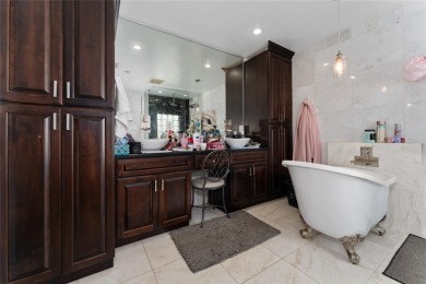 This beautifully maintained home features 4-bedrooms, 2.5-baths on Rio Pinar Golf and Country Club in Florida - for sale on GolfHomes.com, golf home, golf lot