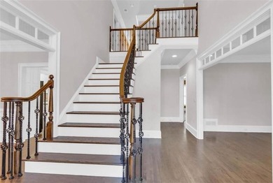 Behind the gates of Sugarloaf Country Club, this 7,000 plus sq on TPC At Sugarloaf Golf Club in Georgia - for sale on GolfHomes.com, golf home, golf lot