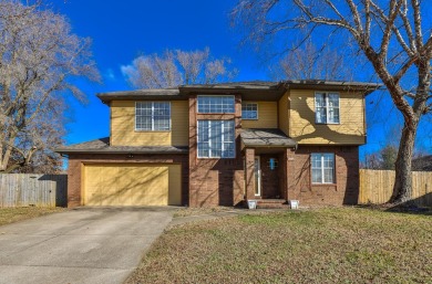 This lovely home with great curb appeal is awaiting its new on Horton Smith Golf Course in Missouri - for sale on GolfHomes.com, golf home, golf lot