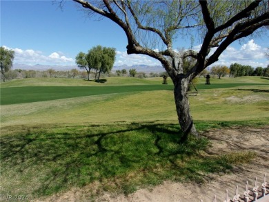 Nestled between the majestic backdrop of golf course greens and on Mojave Resort Golf Club in Nevada - for sale on GolfHomes.com, golf home, golf lot