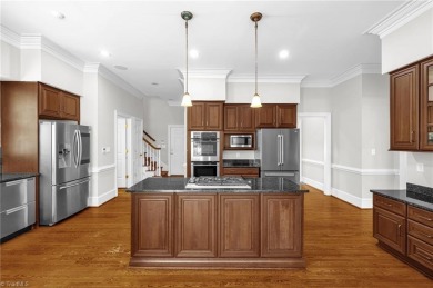 Luxury meets lifestyle in this exceptional estate located in on Sedgefield Golf Course in North Carolina - for sale on GolfHomes.com, golf home, golf lot