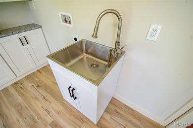 STUNNING MID-CENTURY RANCH - FULLY RENOVATED FOR MODERN LIVING! on Ruth Park Municipal Golf Course in Missouri - for sale on GolfHomes.com, golf home, golf lot