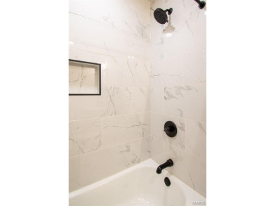 STUNNING MID-CENTURY RANCH - FULLY RENOVATED FOR MODERN LIVING! on Ruth Park Municipal Golf Course in Missouri - for sale on GolfHomes.com, golf home, golf lot