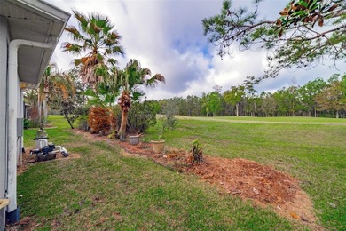 Nestled within a beautifully maintained gated golf course on Hernando Oaks Golf and Country Club in Florida - for sale on GolfHomes.com, golf home, golf lot