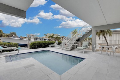 This exceptional waterfront residence in Key Colony Beach offers on Key Colony Beach Golf Course in Florida - for sale on GolfHomes.com, golf home, golf lot