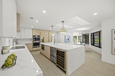 Discover refined luxury in this fully renovated 4,458 sq. ft on PGA National Golf Club in Florida - for sale on GolfHomes.com, golf home, golf lot